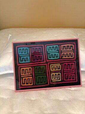 A Framed Panamanian mola textile art piece